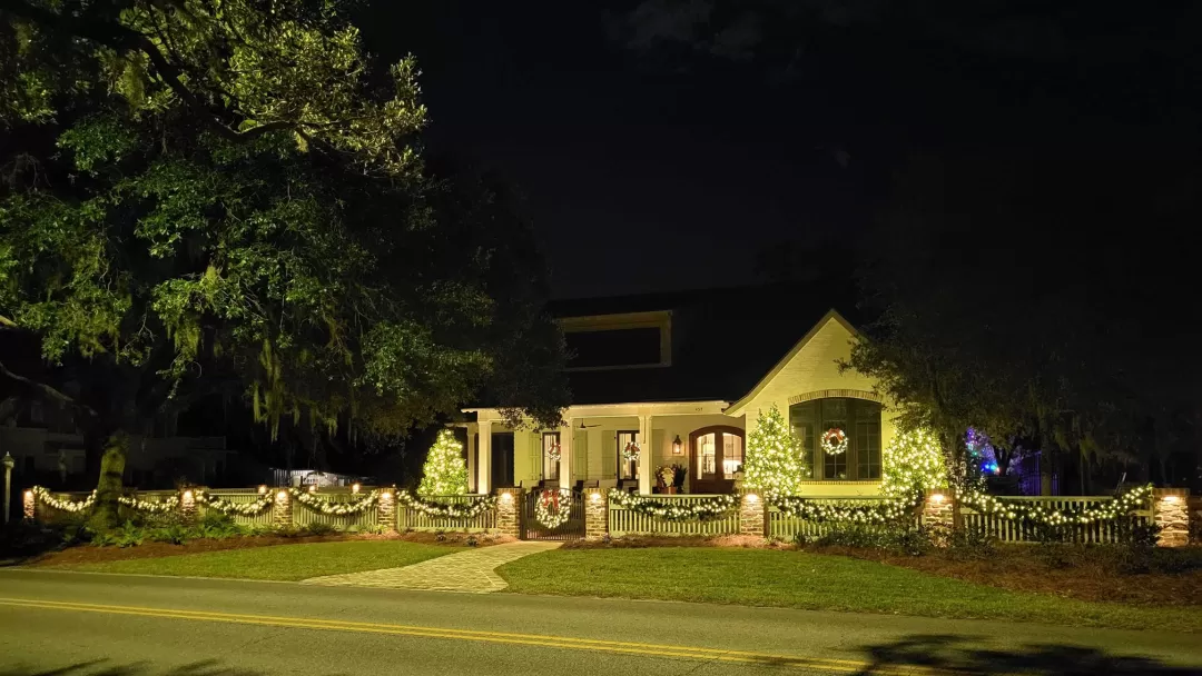 Mini lights, wreaths and garland highlight a home on the bay in Fairhope, Alabama.